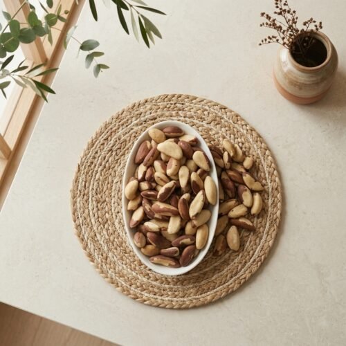 Top-down close-up shot of fresh Brazil nuts from South America, available at Oasis Dry Fruits Bangalore stores.