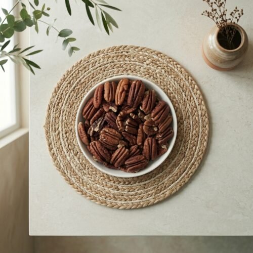 Top-down close-up of original raw pecan kernels, available in 250g and 500g packs at Oasis Dry Fruits Bangalore.