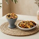 Oasis Dry Fruits premium Muesli Fruit and Nut served in a white bowl and grey cup, showcasing a rich blend of toasted oats, almonds, and dried berries.