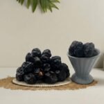 Premium original Ajwa dates from Madinah by Oasis Dry Fruits, featuring a deep black color and unique fine white lines.
