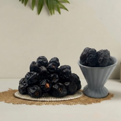 Premium original Ajwa dates from Madinah by Oasis Dry Fruits, featuring a deep black color and unique fine white lines.