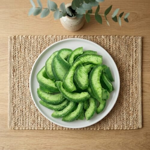 Dried pomelo slices served in a black bowl, ideal for a refreshing healthy snack or as a unique garnish for beverages.