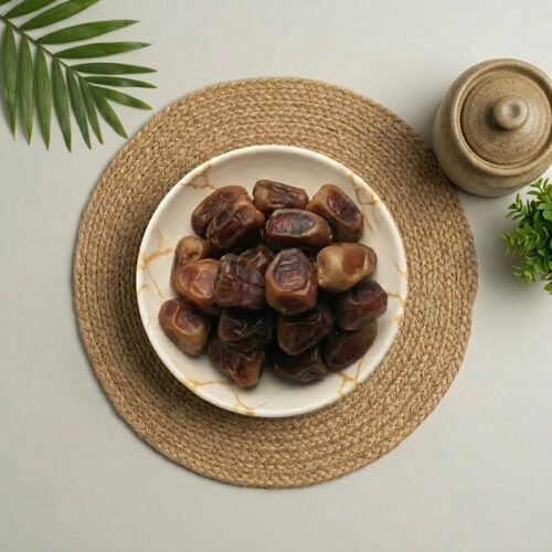 Top-down close-up of original Sukkari dates from Saudi Arabia, available for premium gifting at Oasis Dry Fruits Bangalore