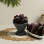 Large premium Amber dates by Oasis Dry Fruits, known for their golden-brown hue and soft, meaty texture.