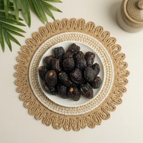 Top-down close-up shot of original medjool dates on a rustic mat, available for online delivery in Bangalore and across India.