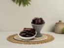 Premium regular-sized Kalmi dates by Oasis Dry Fruits, featuring a rich dark texture and natural chewy sweetness, available for delivery in India.