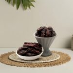 Premium regular-sized Kalmi dates by Oasis Dry Fruits, featuring a rich dark texture and natural chewy sweetness, available for delivery in India.