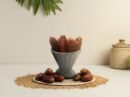 Extra-large premium Mabroom Jumbo dates by Oasis Dry Fruits, featuring a long slender shape and dark mahogany skin.