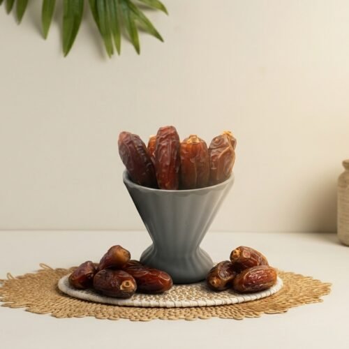 Extra-large premium Mabroom Jumbo dates by Oasis Dry Fruits, featuring a long slender shape and dark mahogany skin.