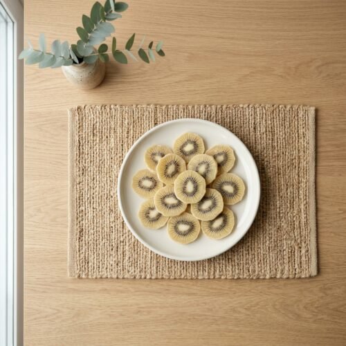 Premium slices of dried golden kiwi by Oasis Dry Fruits, showcasing a unique light-gold color and natural seed pattern.