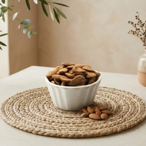 Premium Iran Mamra A5 almonds by Oasis Dry Fruits, showcasing the classic long concave shape and rich golden-brown skin.