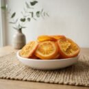 Oasis dried orange slices served in a black bowl, perfect as a Vitamin C-rich healthy snack or a decorative garnish for beverages.