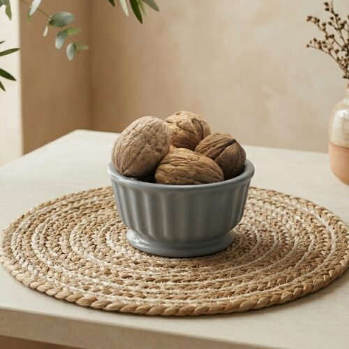 Premium walnuts with shell by Oasis Dry Fruits, featuring a light-colored thin shell and high-quality internal kernels.