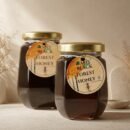 Premium 500g glass jar of Black Forest Honey by Oasis Dry Fruits, showcasing its iconic dark color and thick, syrupy texture.