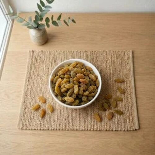 Top view flat lay of organic Afghan raisins premium in a bowl by Oasis Dry Fruits.
