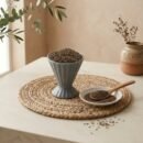 Black Cumin Seeds (Kashmiri Shahi Zeera) served in a pedestal cup by Oasis Dry Fruits.