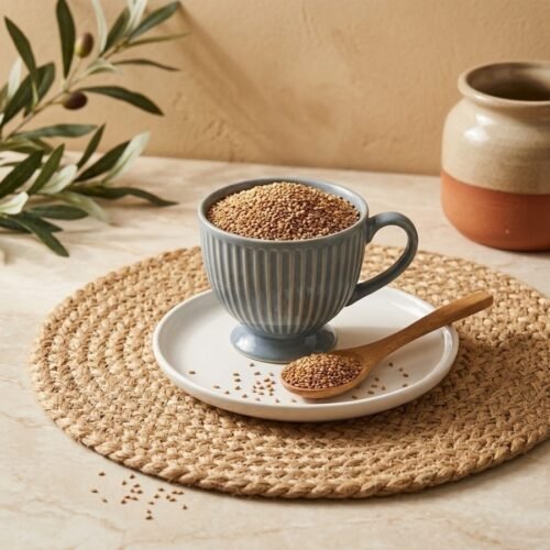 Natural brown sesame seeds filled in a grey ceramic cup by Oasis Dry Fruits.