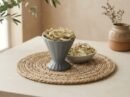 Fresh cashews splits served in a grey pedestal ceramic bowl by Oasis Dry Fruits.