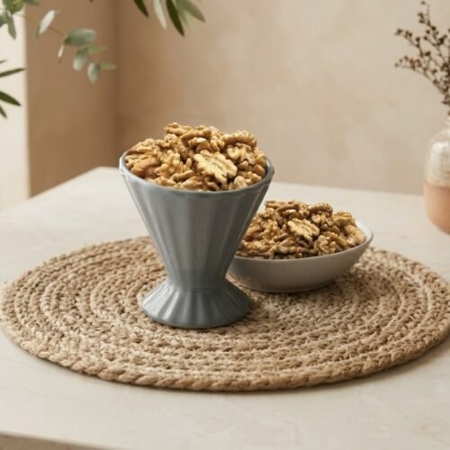 Chile walnut without shell kernels in a grey ceramic cup by Oasis Dry Fruits.