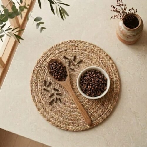 Top view flat lay of premium Cloves with wooden spoon by Oasis Dry Fruits.