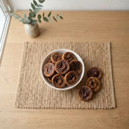 Top view flat lay of organic dried figs jumbo in a bowl by Oasis Dry Fruits.