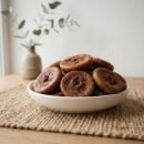 Premium dried figs jumbo served in a white ceramic bowl by Oasis Dry Fruits.
