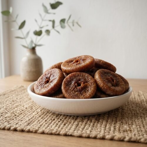 Premium dried figs jumbo served in a white ceramic bowl by Oasis Dry Fruits.