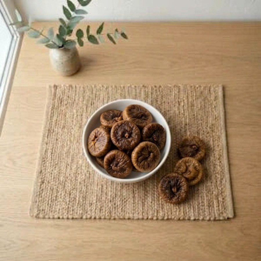 Top view flat lay of organic dried figs king size in a bowl by Oasis Dry Fruits.