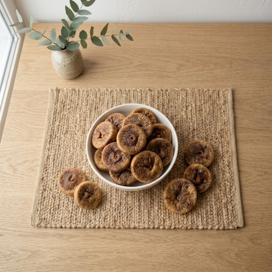 Top view flat lay of organic dried figs large in a bowl by Oasis Dry Fruits.