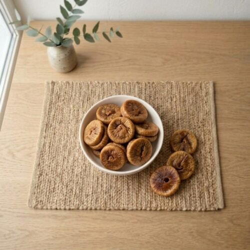 Top view flat lay of organic dried figs super jumbo in a bowl by Oasis Dry Fruits.