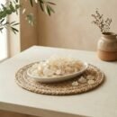 Side angle lifestyle shot of natural Gond Kathira edible gum in a dish by Oasis Dry Fruits.