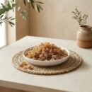 Side angle lifestyle shot of natural Gond edible gum crystals in a dish by Oasis Dry Fruits.