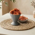 Whole aromatic Jathipathri Javitri mace served in a grey pedestal cup by Oasis Dry Fruits.