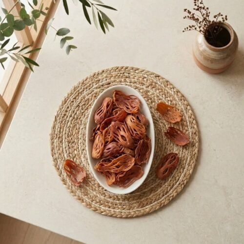 Top view flat lay of premium whole Jathipathri Javitri blades in a dish by Oasis Dry Fruits.