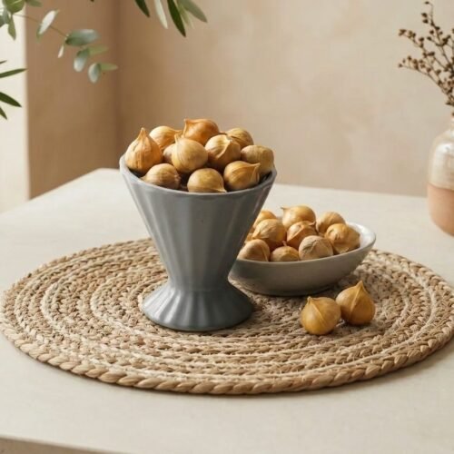 Natural Kashmiri Mountain Garlic bulbs served in a pedestal ceramic cup by Oasis Dry Fruits.