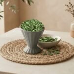 Dried Kasuri Methi served in a grey pedestal ceramic cup by Oasis Dry Fruits.