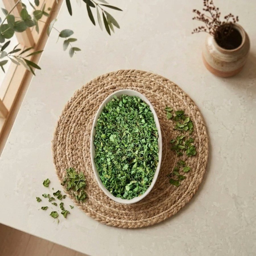 Top view flat lay of organic Kasuri Methi leaves in a ceramic bowl by Oasis Dry Fruits.