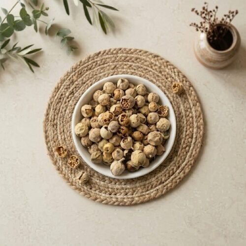 Top view flat lay of organic paneer phool in a white ceramic bowl by Oasis Dry Fruits.