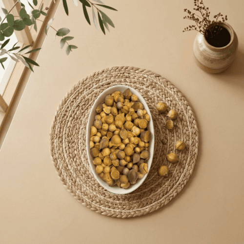Top view flat lay of single clove Kashmiri Mountain Garlic in a dish by Oasis Dry Fruits.