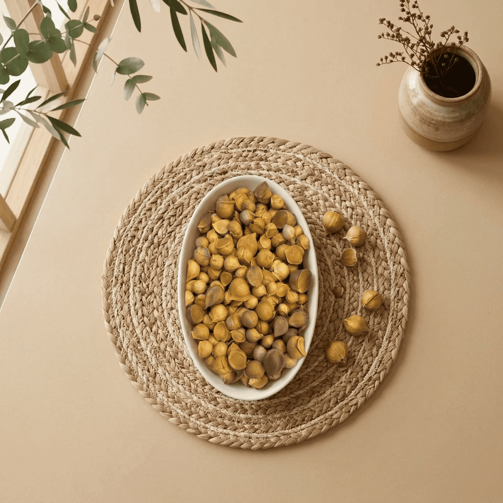 Top view flat lay of single clove Kashmiri Mountain Garlic in a dish by Oasis Dry Fruits.