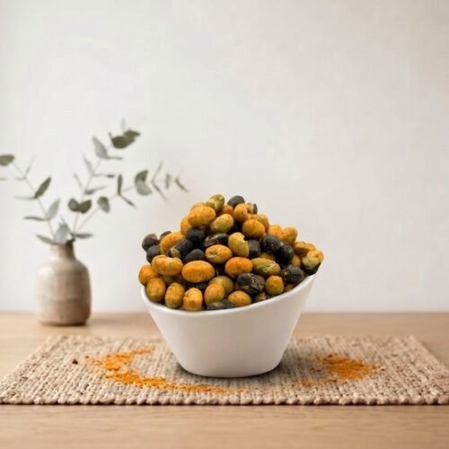 Side angle lifestyle shot of flavorful Masala Protein Beans in a white bowl by Oasis Dry Fruits.
