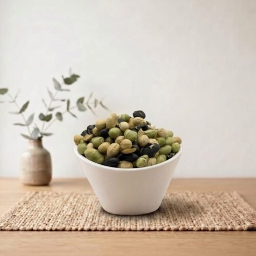 Side angle lifestyle shot of organic Protein Beans in a white bowl by Oasis Dry Fruits.