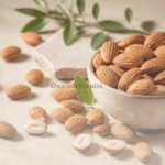 Fresh raw almonds and green leaves illustrating the health benefits of almonds.