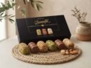 Barquillo Assorted Gift Box 180g with a row of pistachio, hazelnut and almond wafer rolls