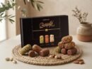 Barquillo Assorted Gift Box 320g with a stacked display of pistachio, hazelnut and almond rolls