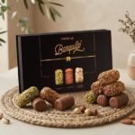 Barquillo Assorted Gift Box 320g with a stacked display of pistachio, hazelnut and almond rolls