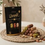 Barquillo Assorted Pouch 400g beside a generous pile of pistachio, hazelnut and almond rolls