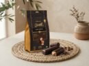 Cocoa Melts Dark Coffee 100g pouch with dark chocolate wafer rolls and coffee beans