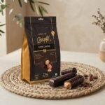 Cocoa Melts Dark Coffee 100g pouch with dark chocolate wafer rolls and coffee beans