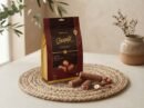 Cocoa Melts Hazelnut 100g pouch with milk chocolate wafer rolls and hazelnuts